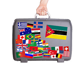 Image showing Used plastic suitcase with stickers