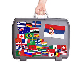 Image showing Used plastic suitcase with stickers