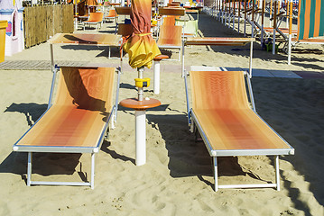 Image showing Sunbeds and umbrellas on the beach