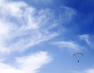 Image showing Silhouette of skydiver at sky