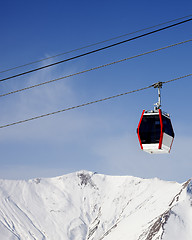 Image showing Gondola lift and snowy mountains