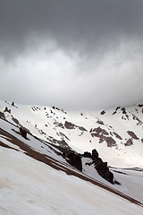 Image showing Snowy mountains in bad weather