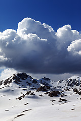 Image showing Snowy mountains and sky with clouds