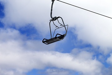 Image showing Chair-lift and blue sky with clouds
