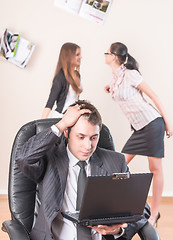 Image showing Businessman works with laptop and is distressed