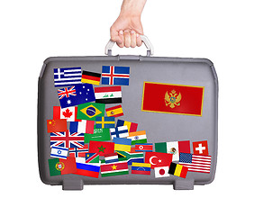 Image showing Used plastic suitcase with stickers