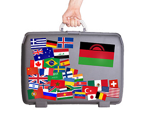 Image showing Used plastic suitcase with stickers