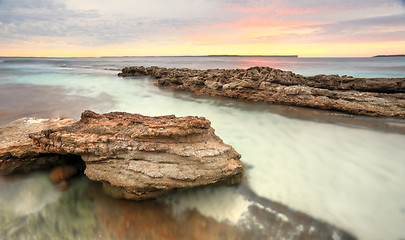 Image showing Soft pastel colours of a sunrise at Hyams Beach Australia