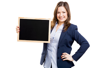 Image showing Business woman holding a shalkboard