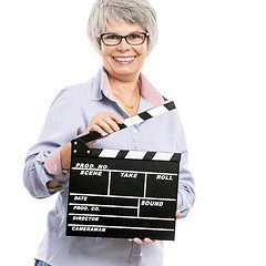 Image showing Elderly woman holding a clapboard