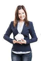 Image showing Business woman with a piggy bank