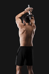 Image showing Muscular man lifting weights