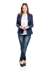 Image showing Business woman with a piggy bank