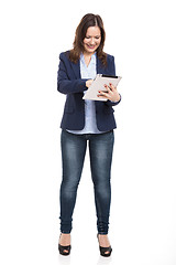 Image showing Business woman working with a tablet