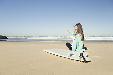 Image showing Teen girl surfing 