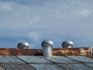 Image showing Three ventilators on a roof