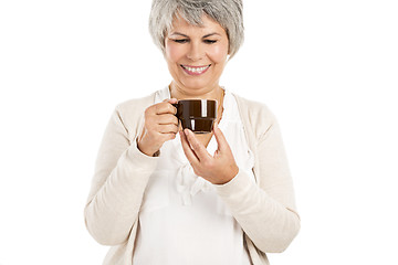 Image showing Elderly woman drinking coffee