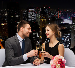 Image showing couple with glasses of champagne at restaurant