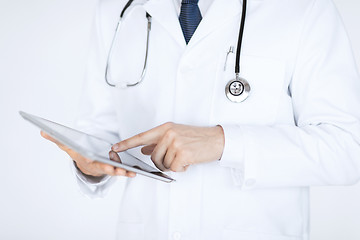 Image showing male doctor holding tablet pc