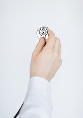 Image showing doctor hand with stethoscope listening somebody