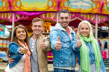 Image showing group of smiling friends showing thumbs up