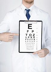 Image showing male ophthalmologist with eye chart