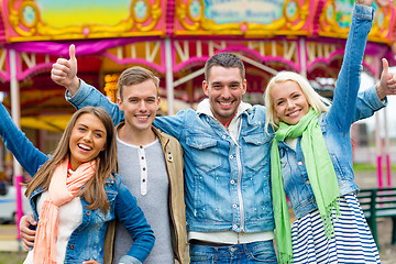 Image showing group of smiling friends showing thumbs up