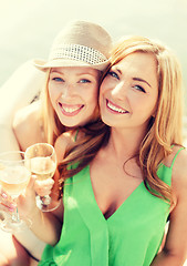 Image showing smiling girls with champagne glasses