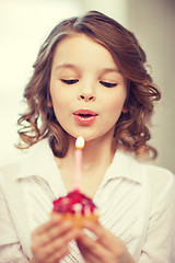 Image showing girl with cupcake