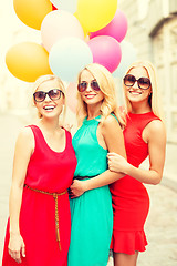 Image showing beautiful girls with colorful balloons in the city