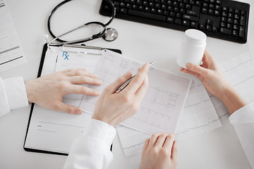 Image showing two doctors prescribing medication