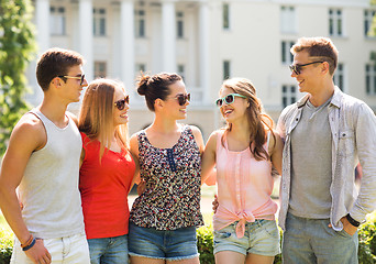 Image showing group of smiling friends outdoors