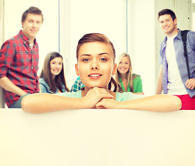 Image showing woman with white blank board at school