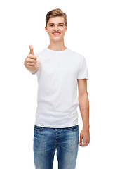 Image showing smiling man in white t-shirt showing thumbs up