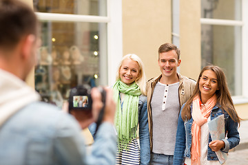 Image showing group of smiling friends taking photo outdoors