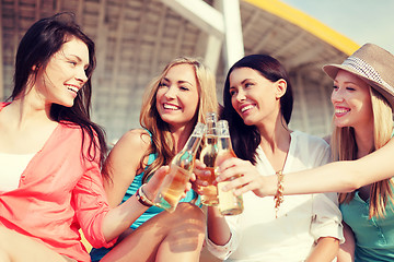 Image showing girls with drinks on the beach