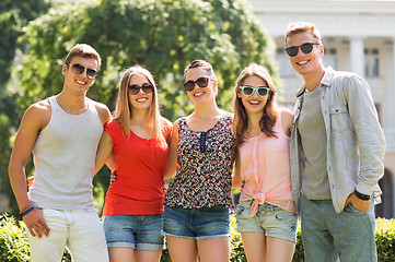 Image showing group of smiling friends outdoors