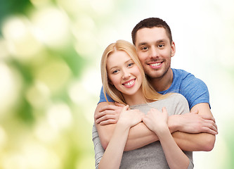 Image showing smiling couple hugging