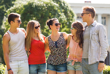 Image showing group of smiling friends outdoors