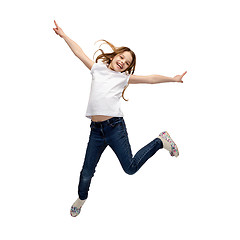 Image showing smiling little girl jumping