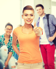 Image showing woman showing thumbs up at school