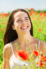 Image showing laughing young woman on poppy field