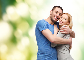 Image showing smiling couple hugging