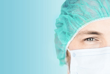 Image showing surgeon in medical cap and mask