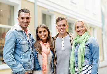 Image showing group of smiling friends in city