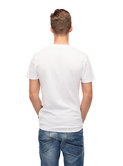 Image showing young man in blank white t-shirt from back