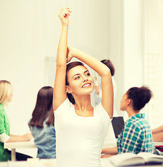 Image showing happy student girl with hands up