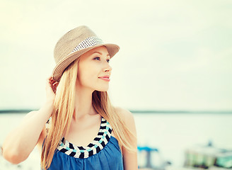 Image showing girl in hat standing on the beach