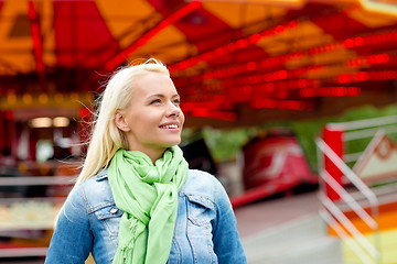 Image showing smiling young woman in amusement park