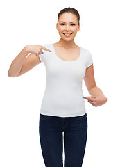 Image showing smiling young woman in blank white t-shirt